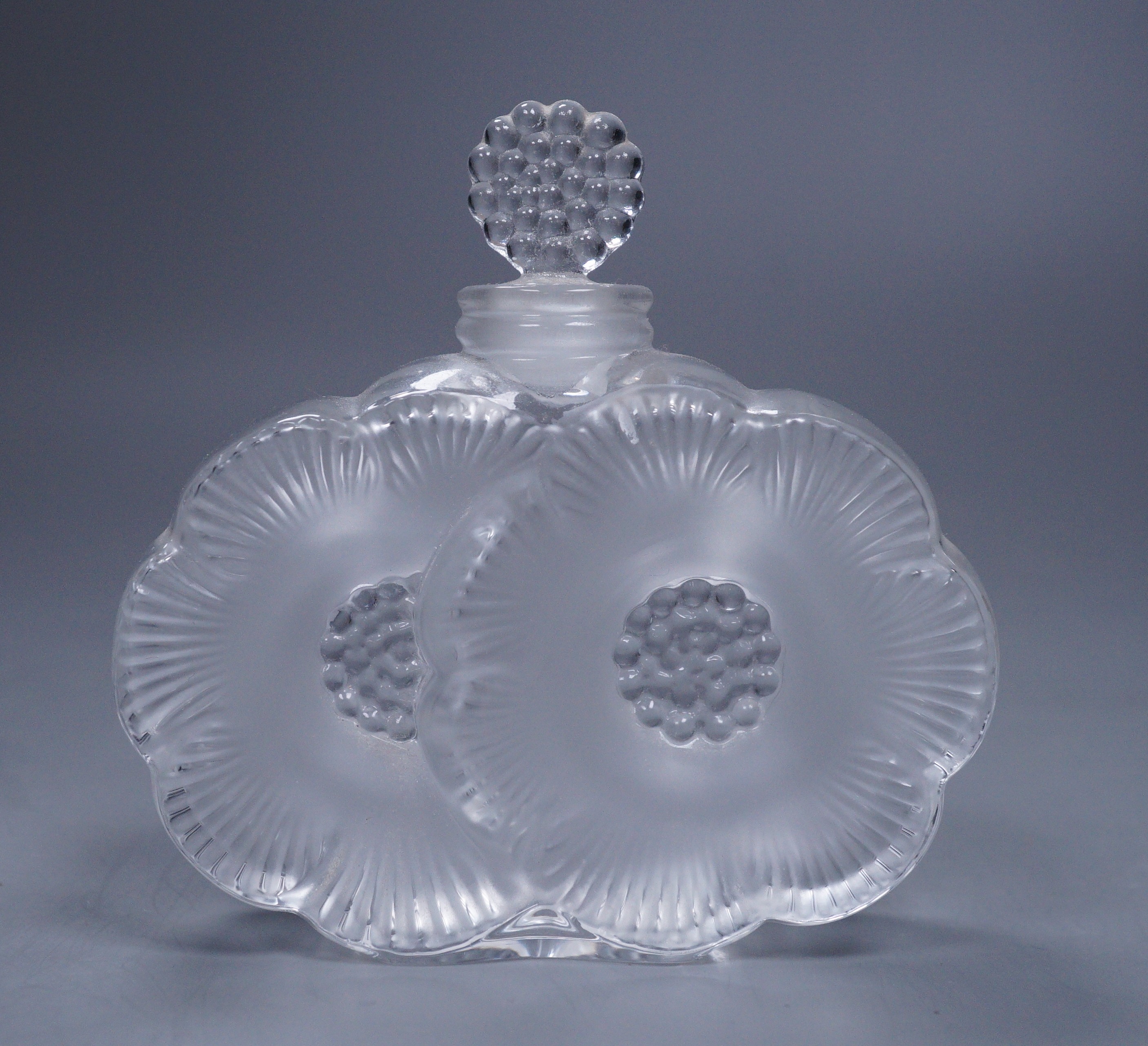 A Lalique Deux Fleurs scent bottle with stopper, 9cm tall